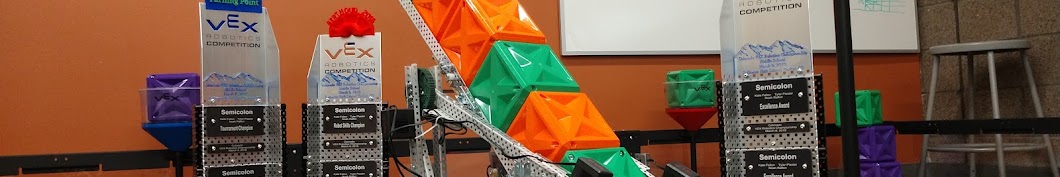 Semicolon Tower Takeover tray robot with orange and green cubes beside team trophies